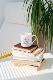 white ceramic mug on brown wooden table