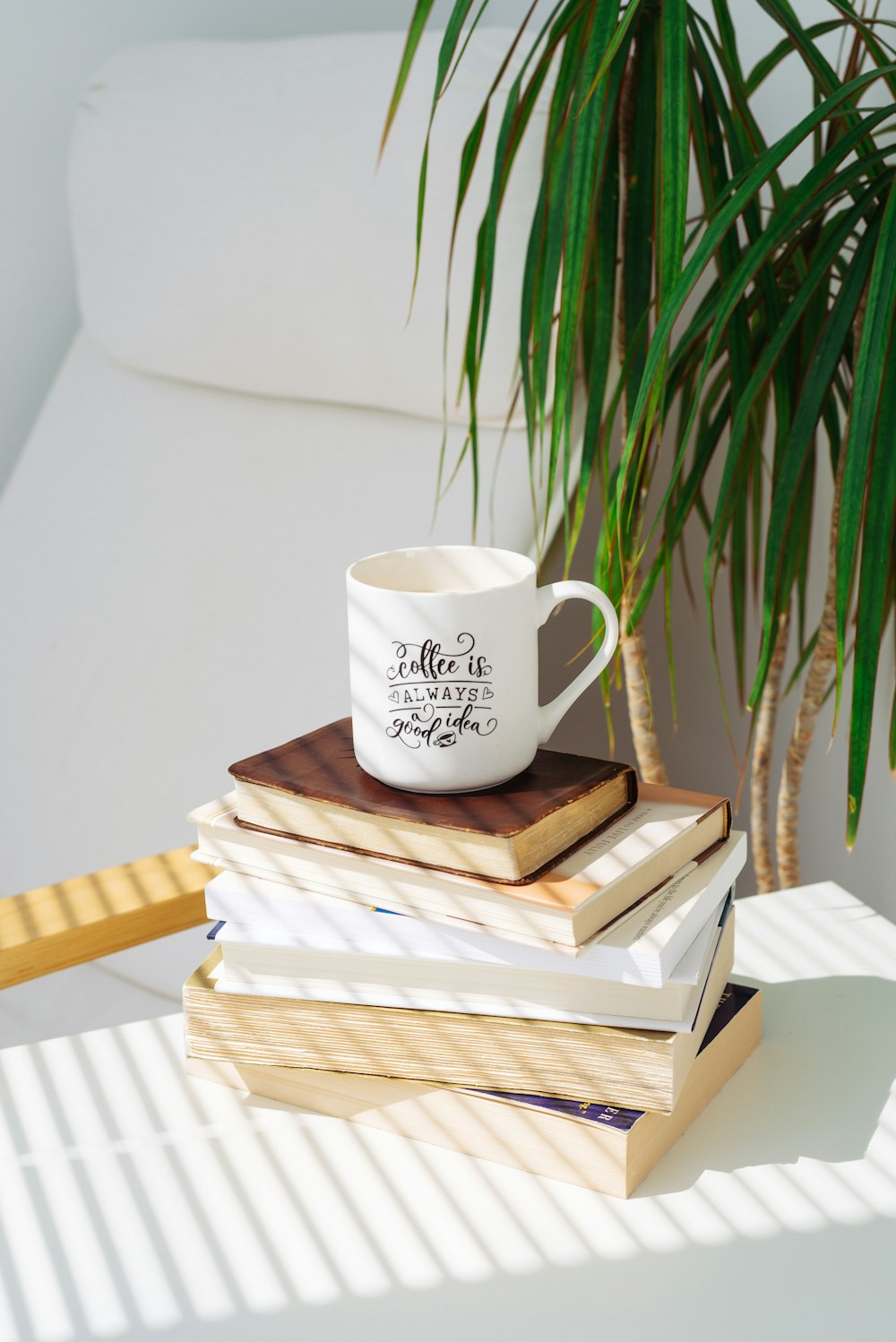 white ceramic mug on brown wooden table