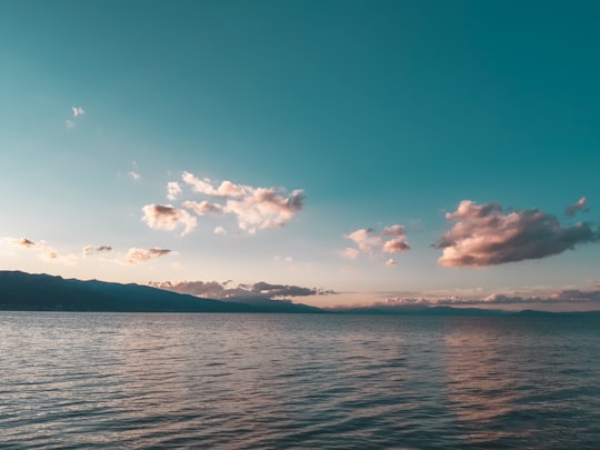 blue sea under blue sky and white clouds during daytime in Pogradec Albania