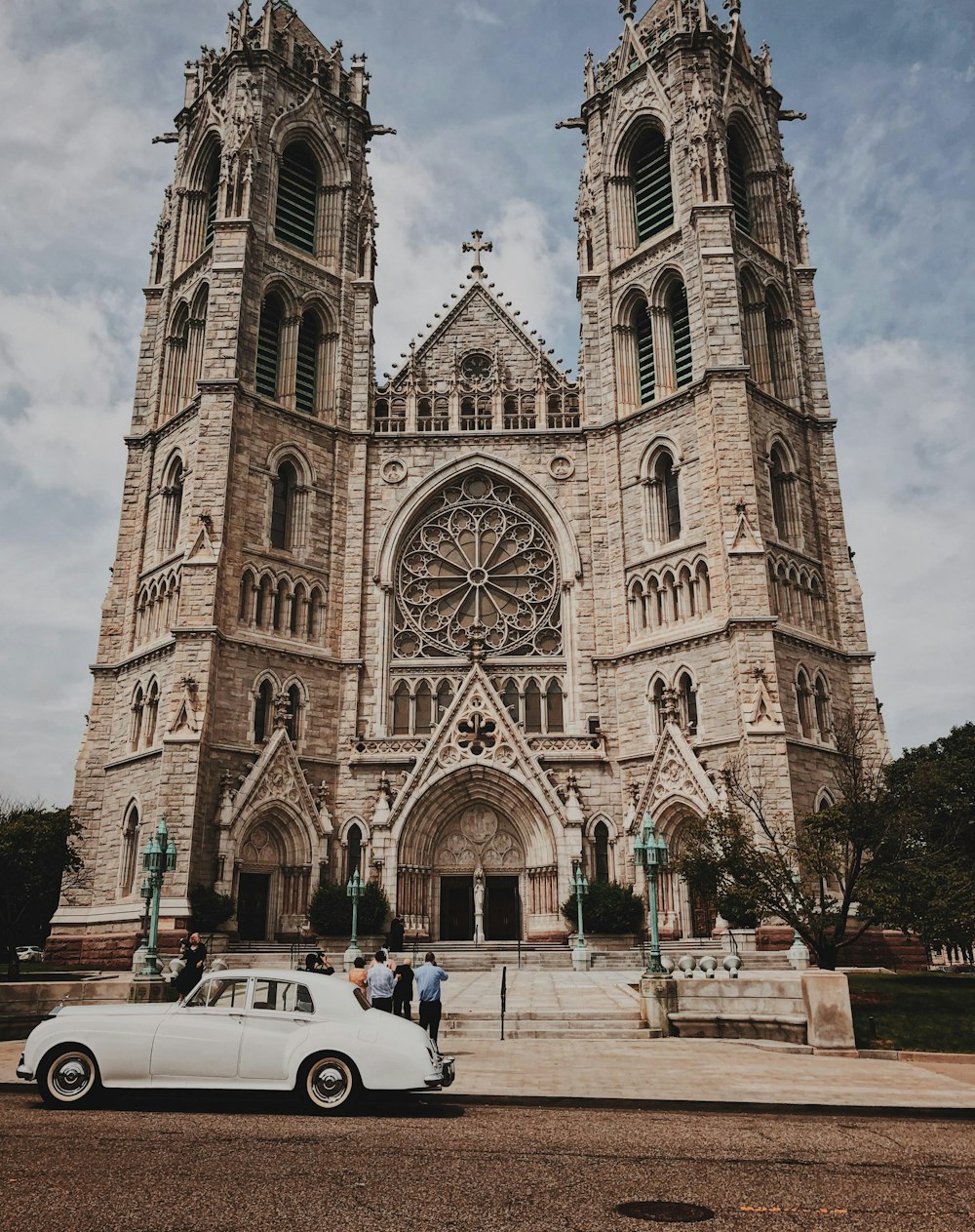 people walking near brown concrete church during daytime