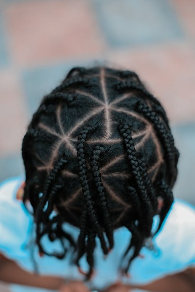 Freestyle cornrows with a heart design.