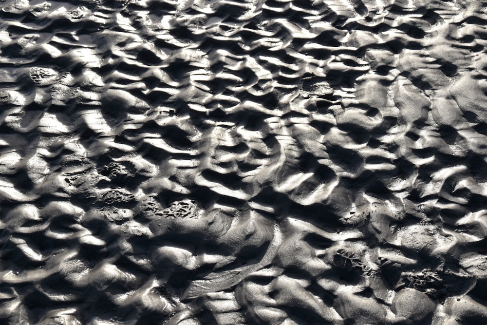 brown sand with water during daytime