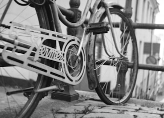 grayscale photo of bicycle on road