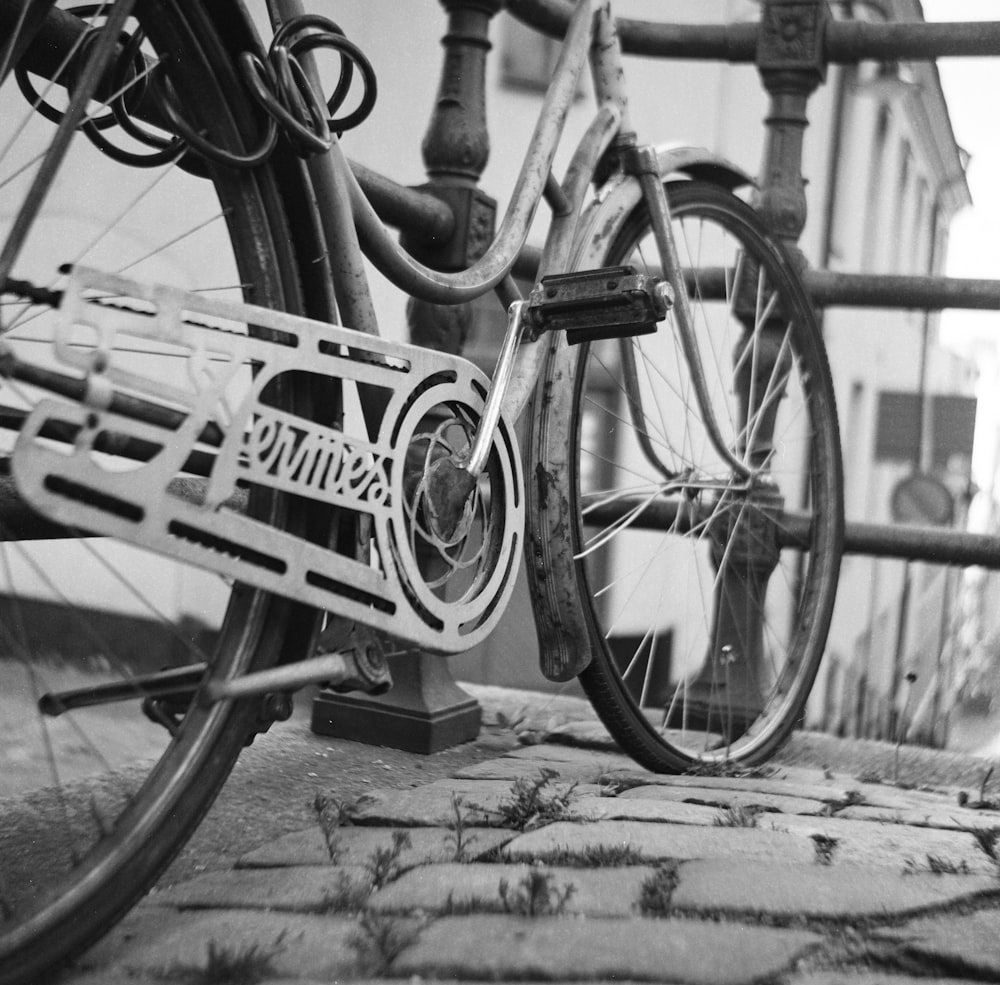 grayscale photo of bicycle on road