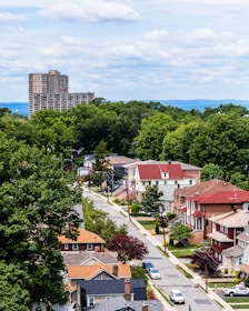 A serene suburban neighborhood showcasing homes with diverse styles and landscaped yards.