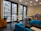 Image of a modern office breakroom with branded Nexacore coffee and snack displays.