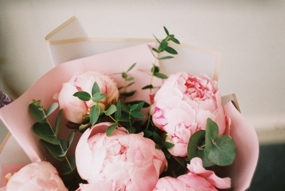 pink roses on white table