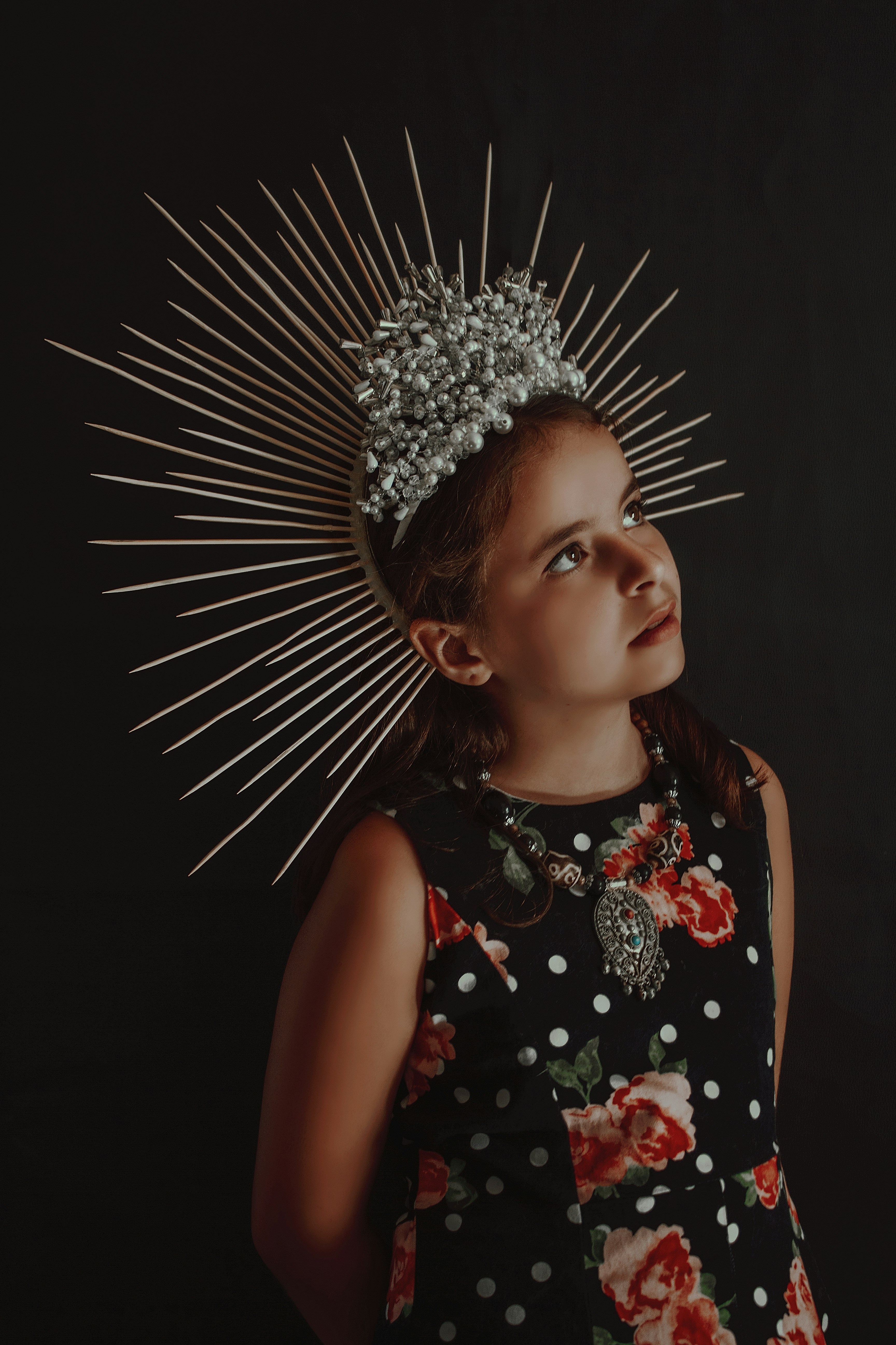 girl in black white and red floral sleeveless dress