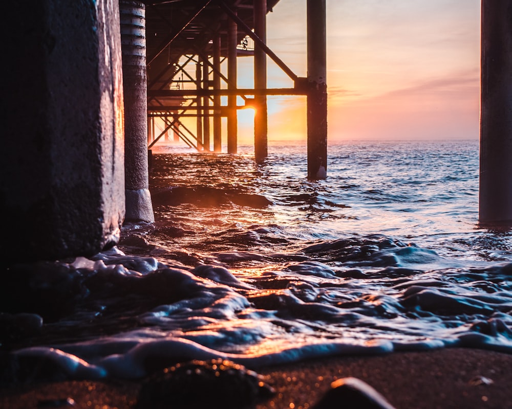 brown wooden dock on sea during daytime