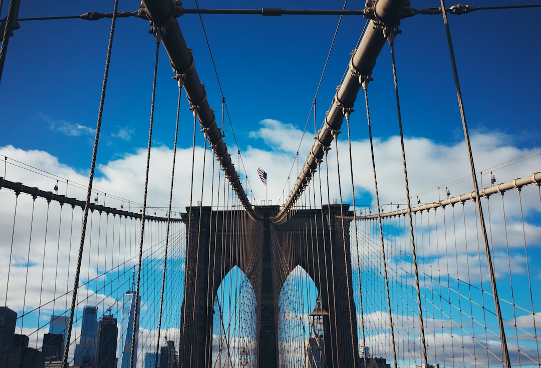 blue and white bridge under blue sky during daytime