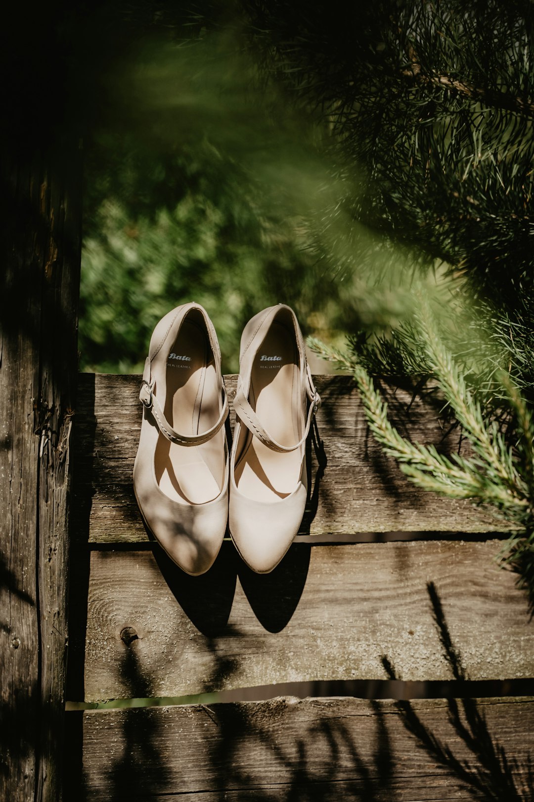 brown leather shoes on brown wooden plank