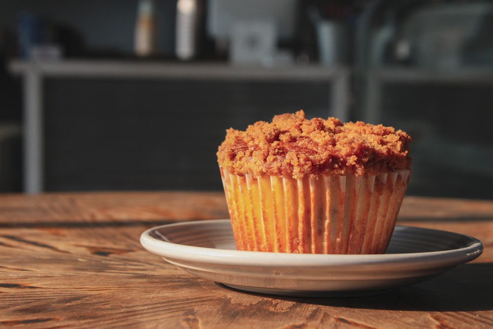 brown cupcake on white ceramic plate