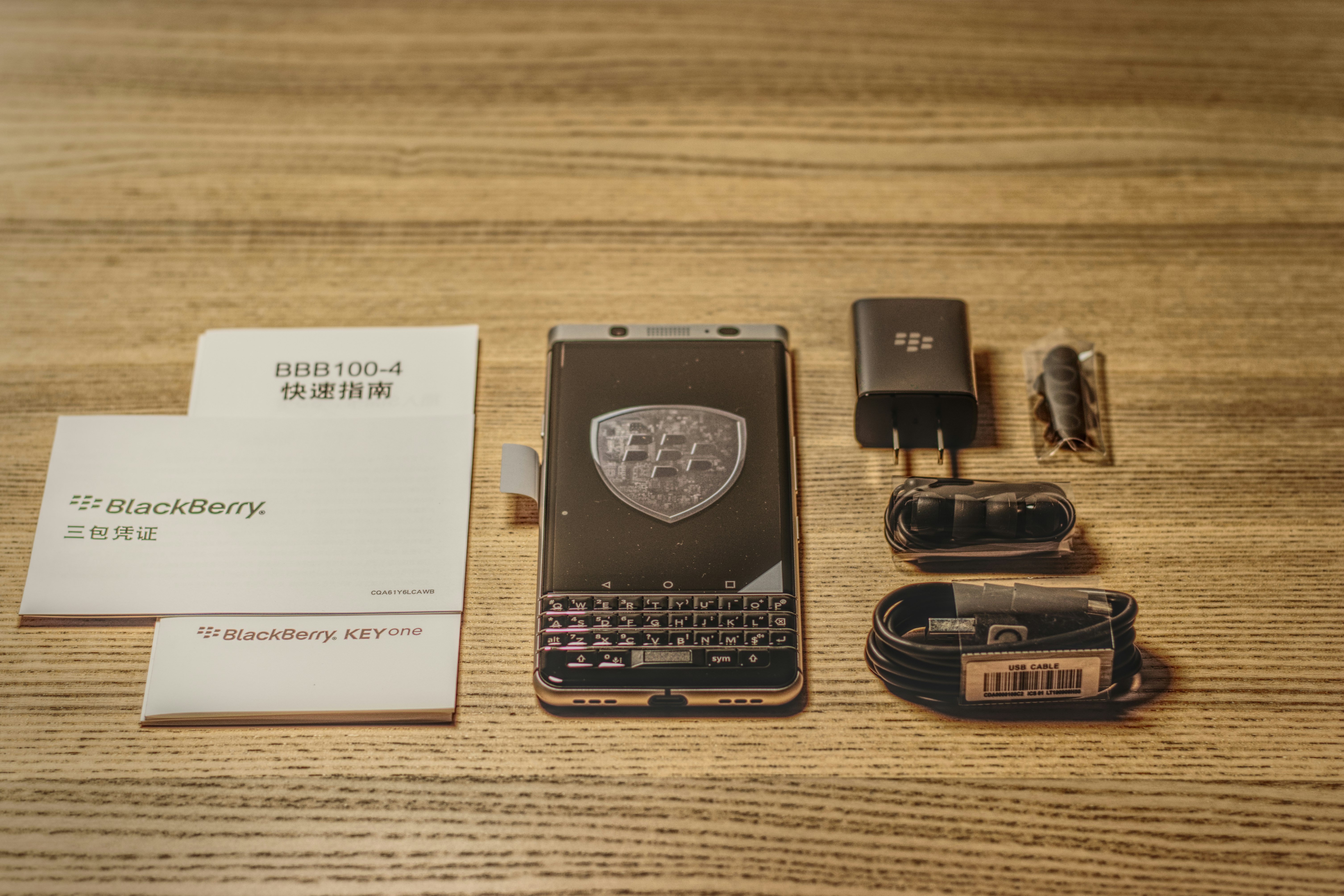 black iphone 7 on brown wooden table