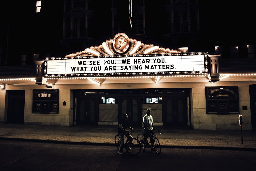 black bicycle parked in front of building