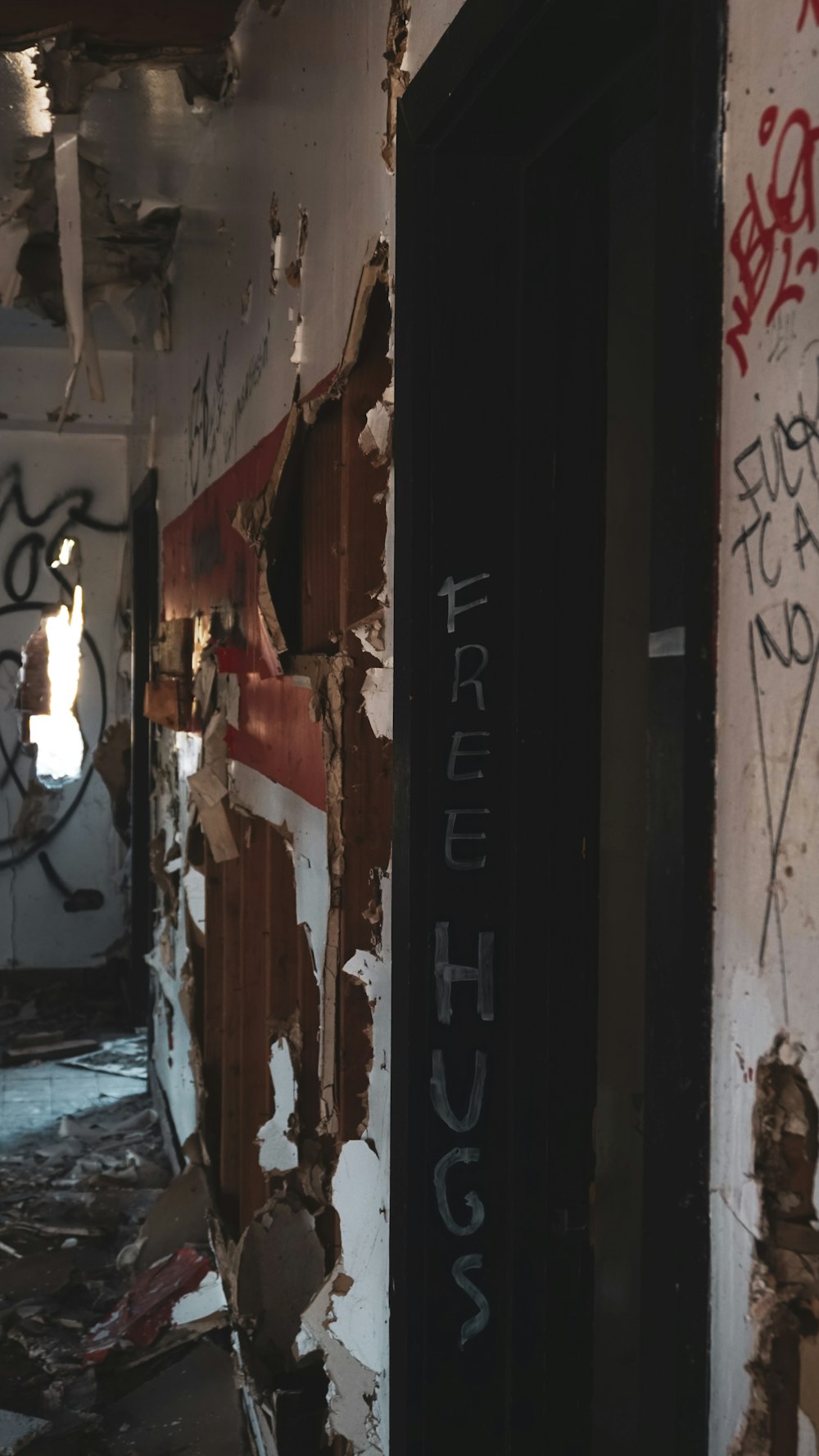 black wooden door with white and red paint