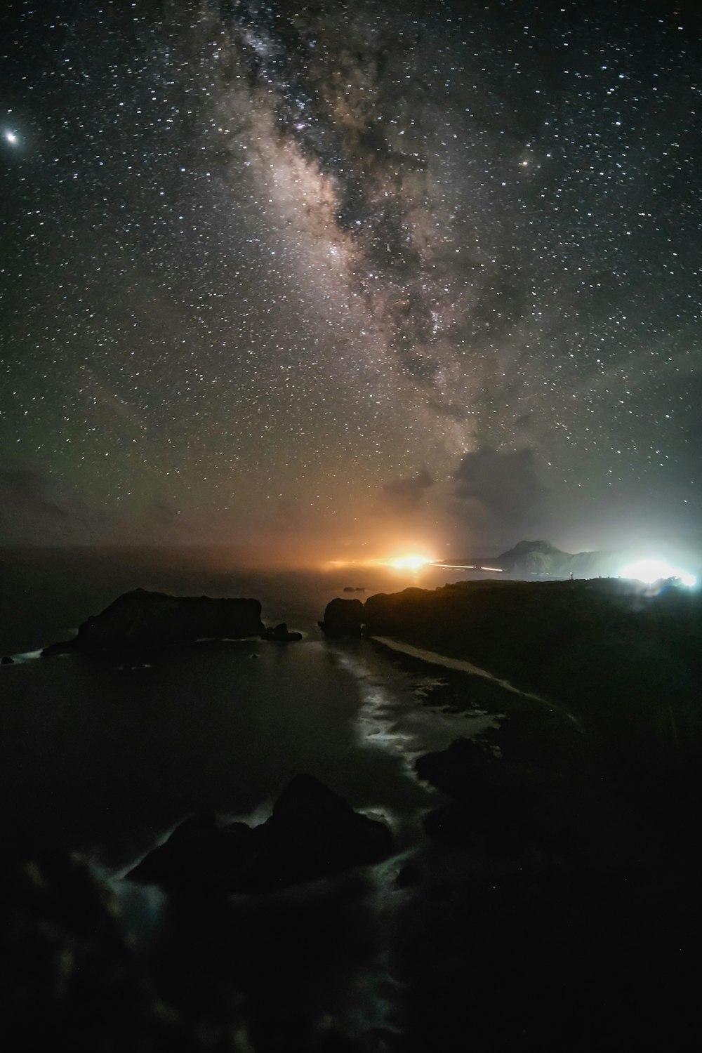 body of water under starry night