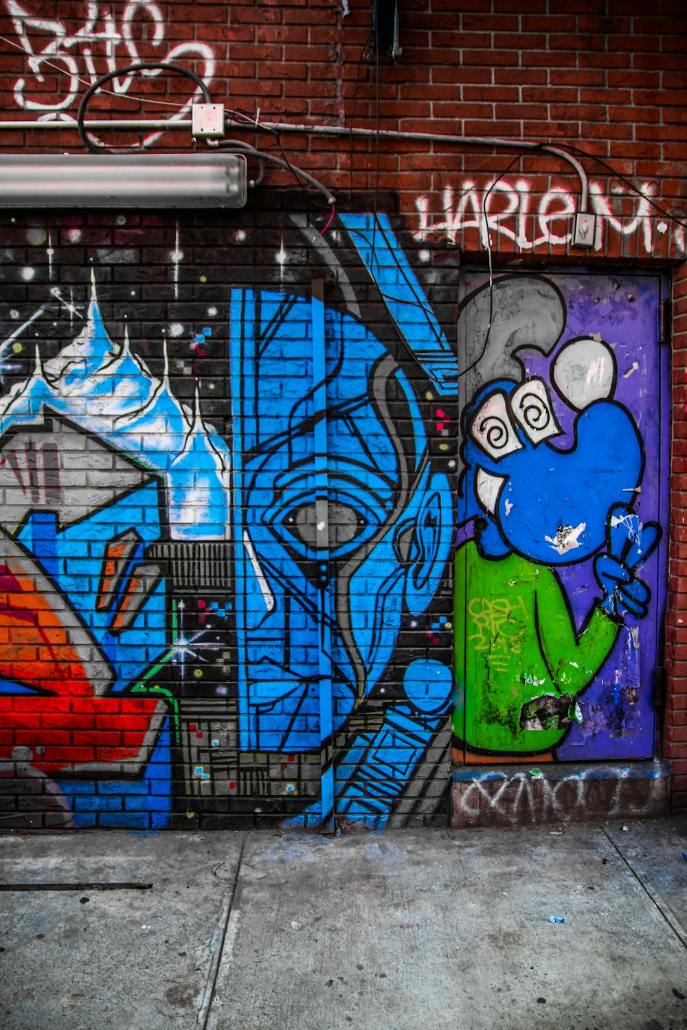 blue and green woman with green hair and green eyes graffiti
