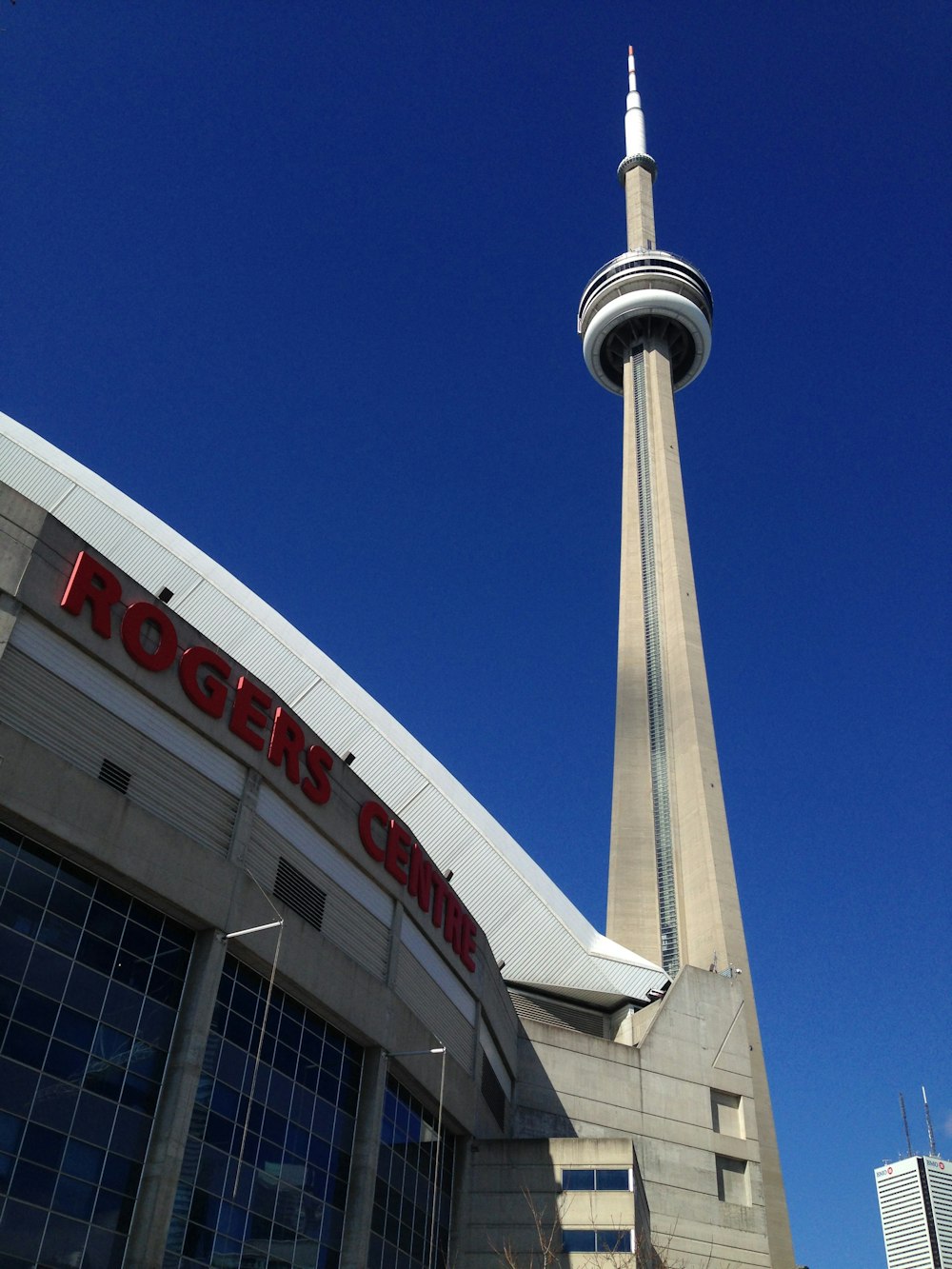 white and red concrete building under blue sky during daytime