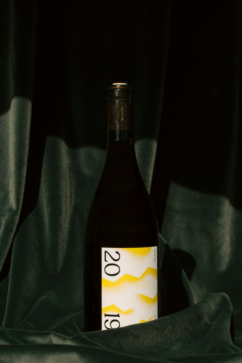white and black labeled bottle