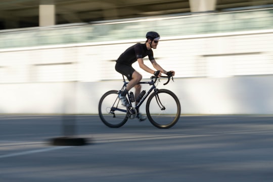 man in black shirt riding on bicycle in Circuit Gilles-Villeneuve Canada