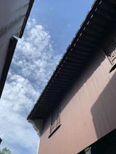 A panoramic view of Fes’s ancient medina rooftops under a clear blue sky.