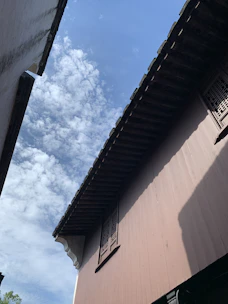 A panoramic view of Fes’s ancient medina rooftops under a clear blue sky.