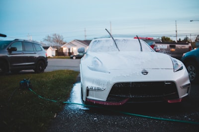 white porsche 911 on road during daytime nissan google meet background