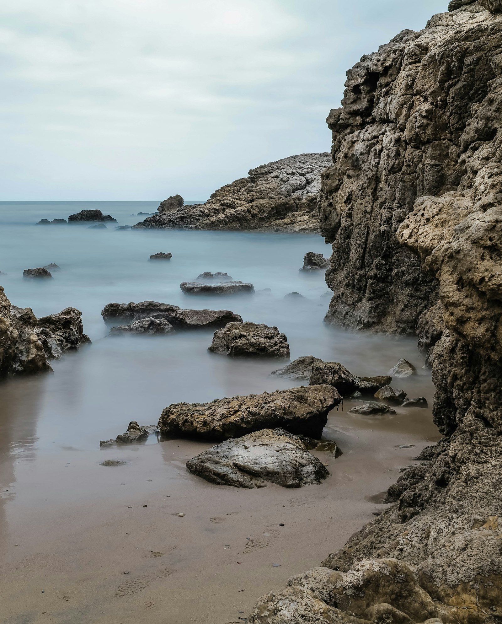 Leica SL2 sample photo. Brown rocky shore during photography