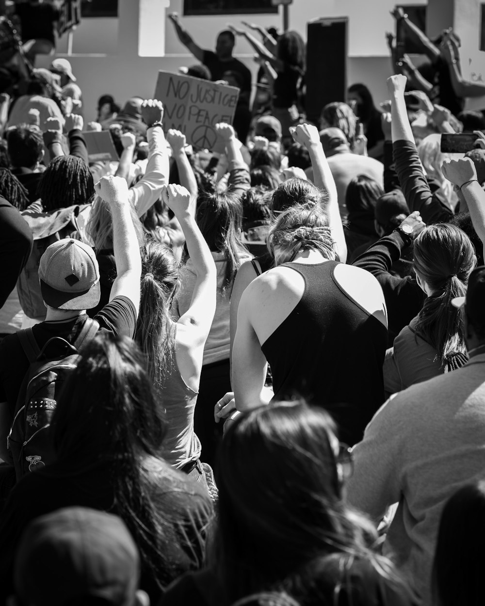 grayscale photo of people in a concert