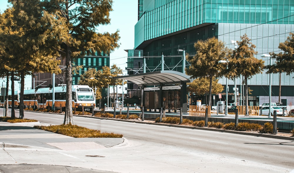 white van parked near green building during daytime