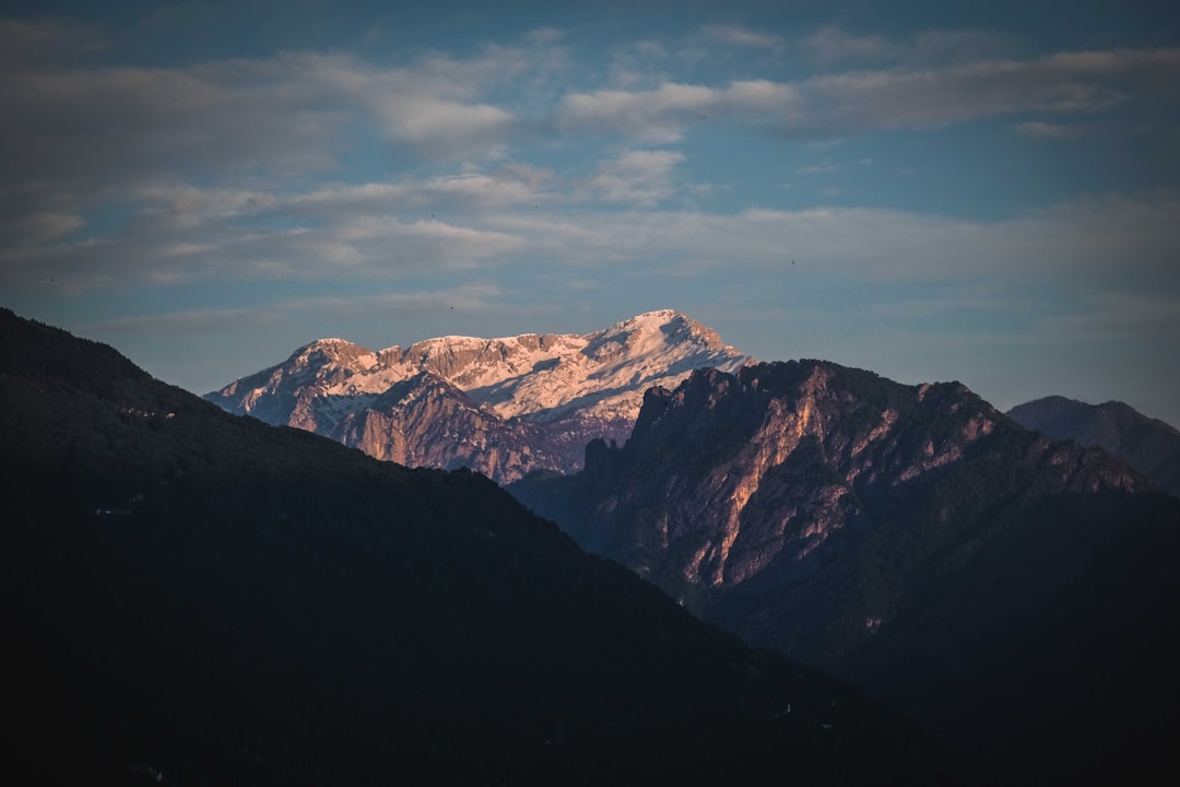 brown and white mountains under blue sky during daytime