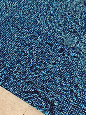 Close-up of pool tiles gleaming after a detailed bead blast cleaning.