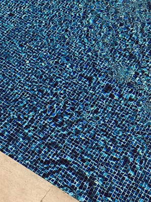 Before and after shots showing a pool resurfaced with premium Duraquartz plaster.