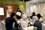 Trainer leading a hands-on security and safety workshop with attentive participants.