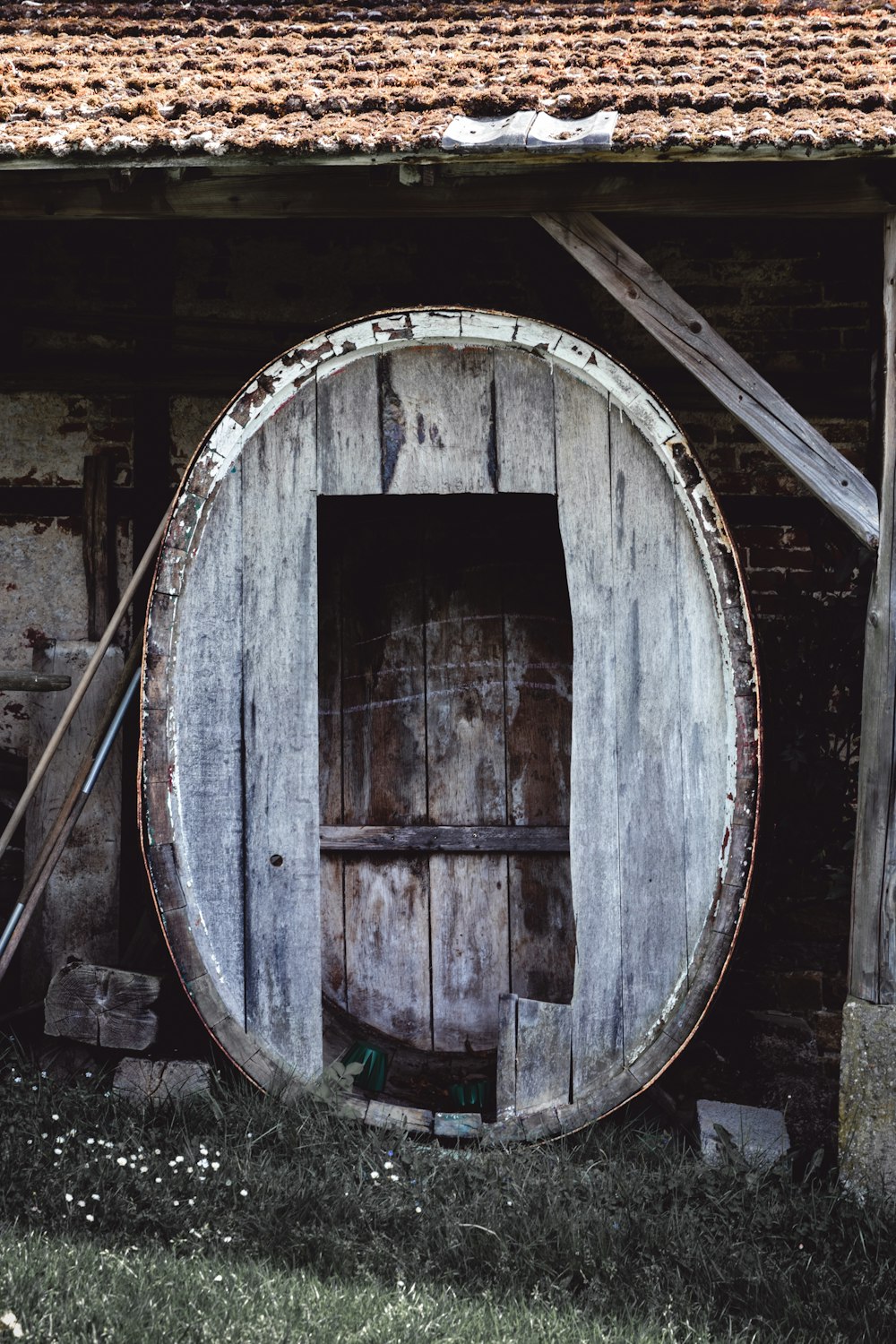 brown wooden round door near brown wooden wall