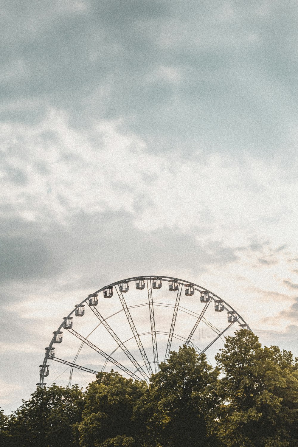 white ferris wheel under blue sky during daytime