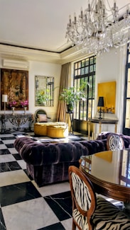 blue and white sofa chair near green potted plant