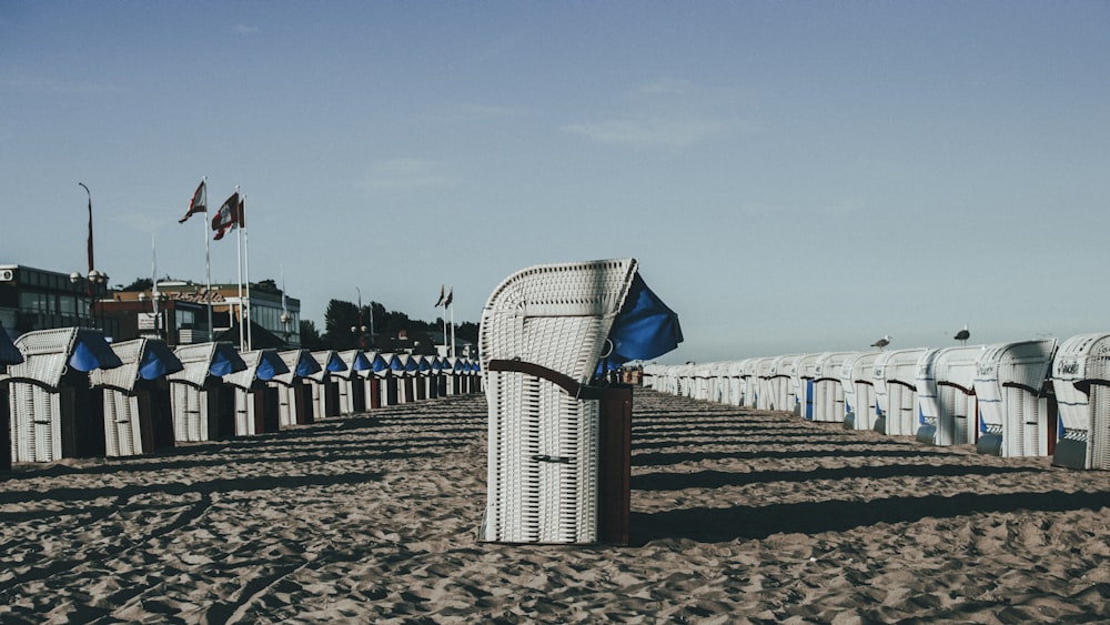 blue and white umbrella on beach during daytime