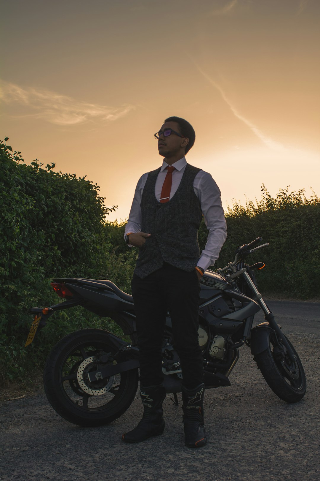 man in black jacket riding on black motorcycle during daytime