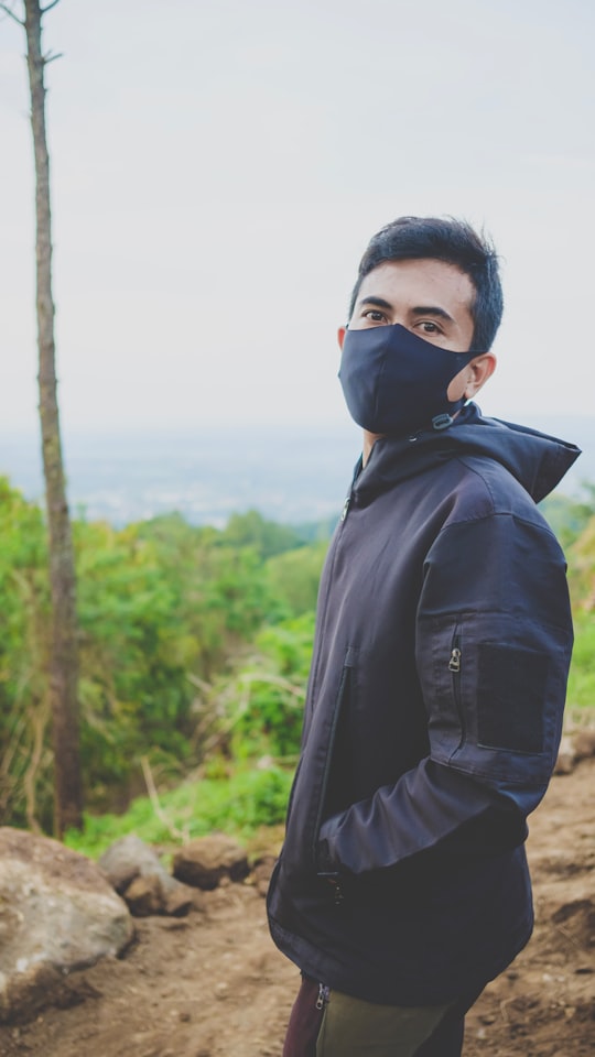 man in black leather jacket wearing black mask in Kuningan Indonesia