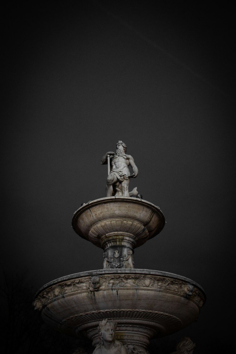 gold statue of man with wings