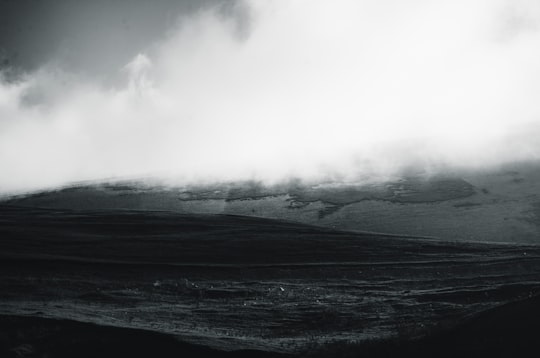 grayscale photo of mountain covered by clouds in Masal Iran