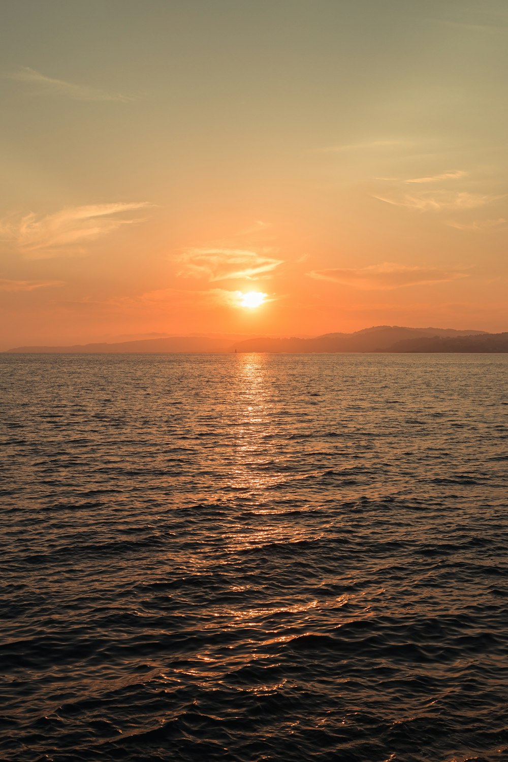 body of water during sunset