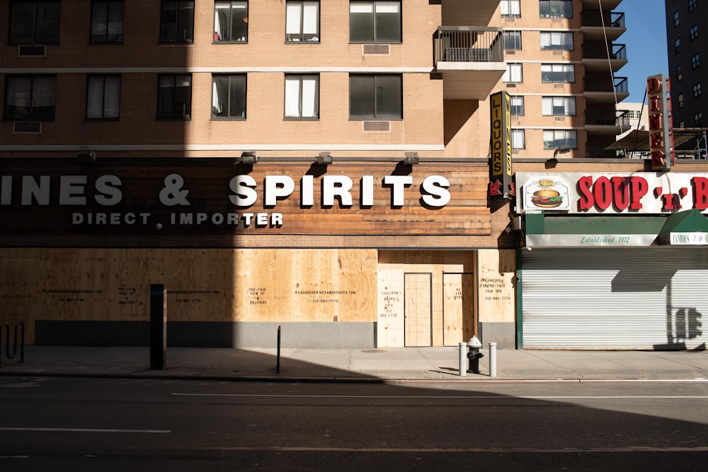 brown and white concrete building during daytime at Manhattan NYC