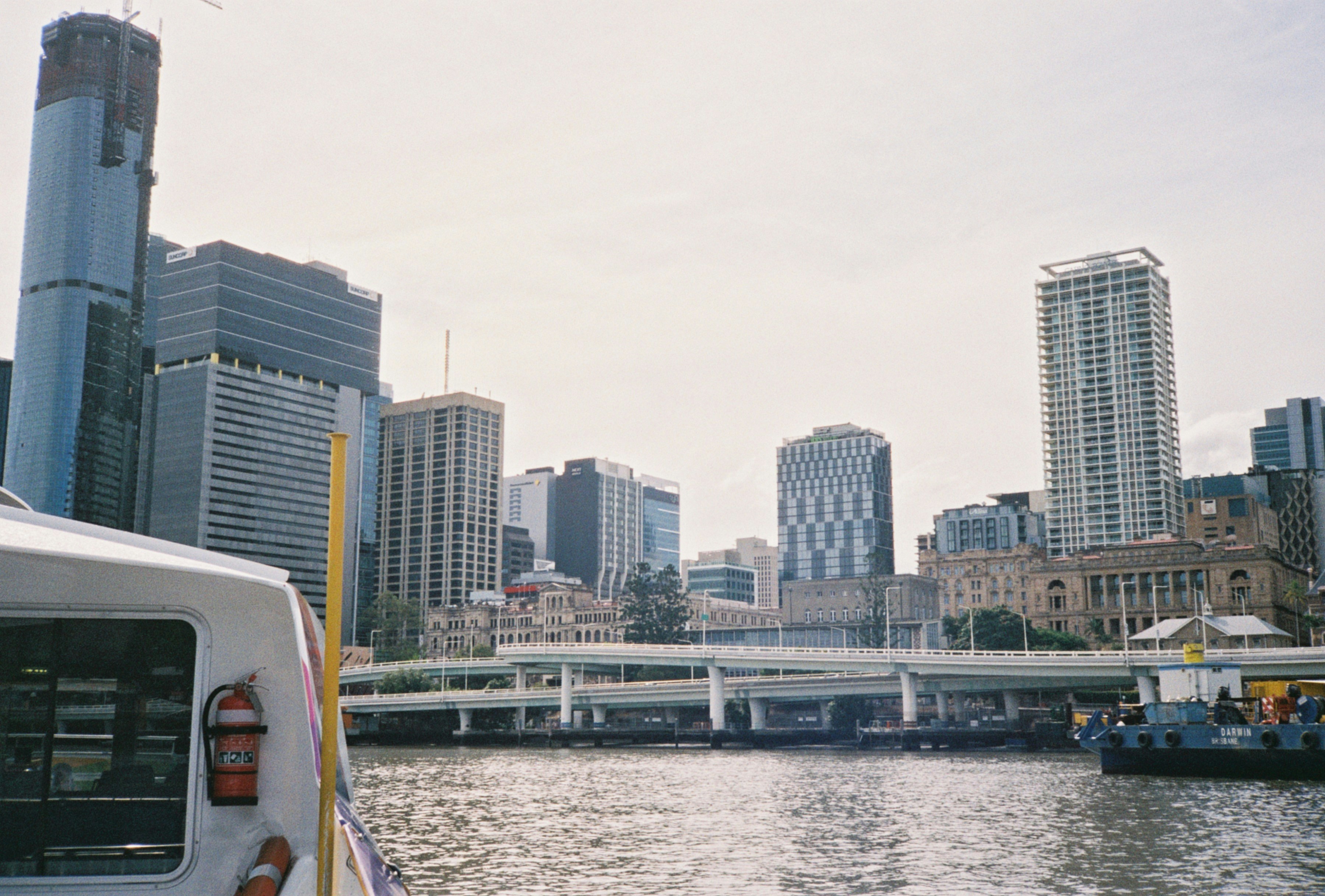 white and blue high rise buildings near body of water during daytime
