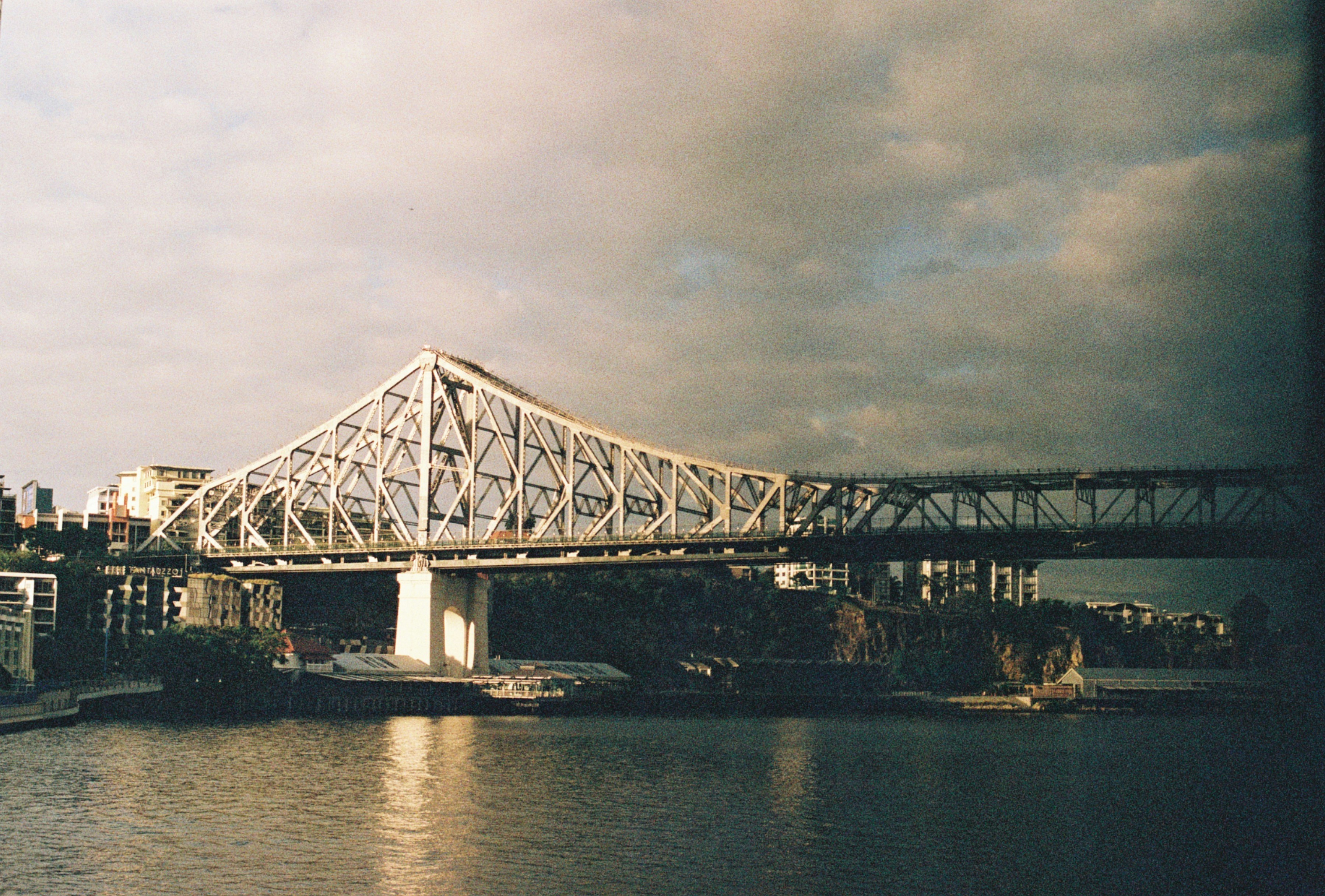 white and gray bridge under gray sky