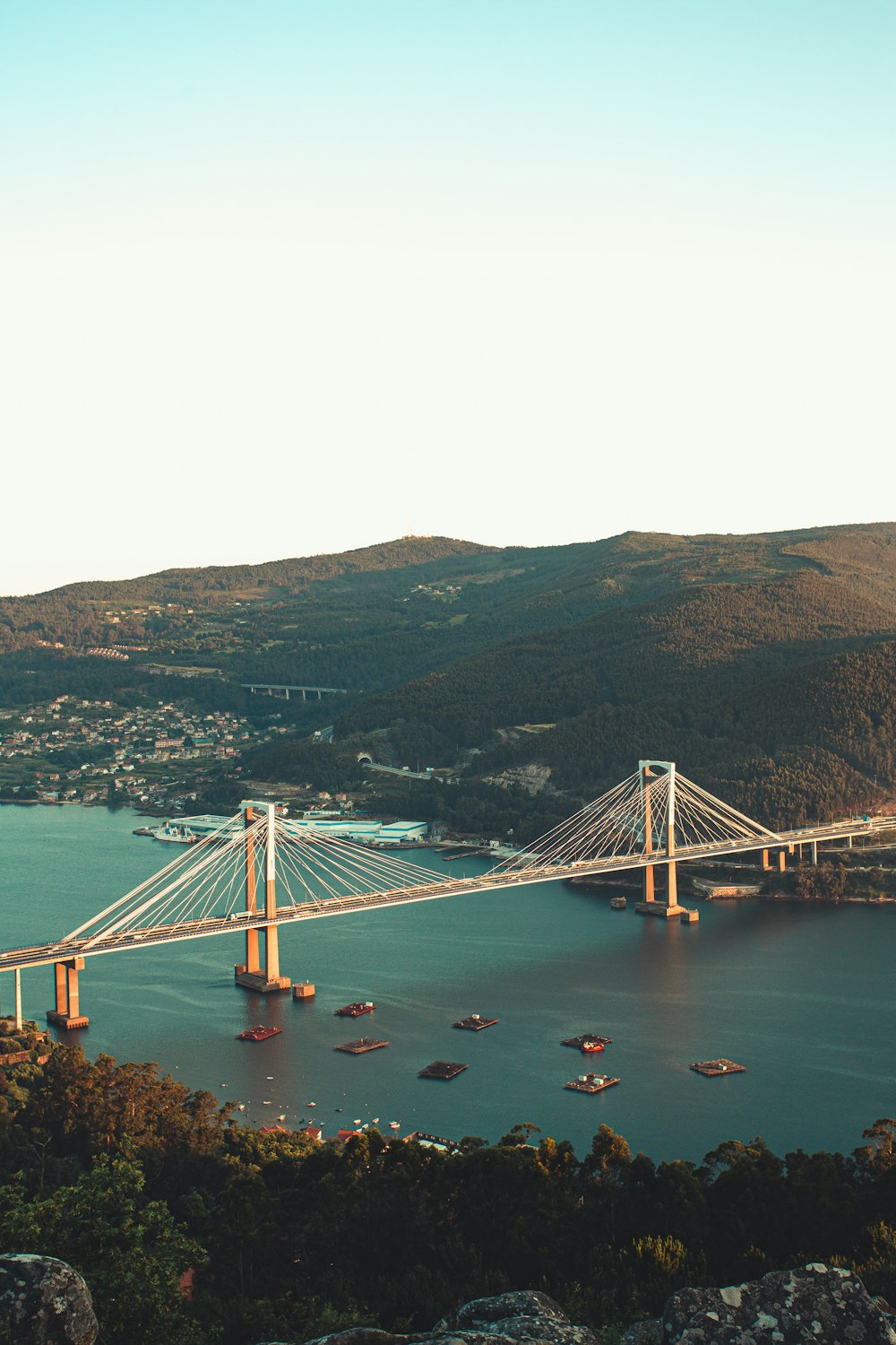 white bridge over body of water during daytime