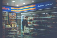 man in black shirt standing near the counter