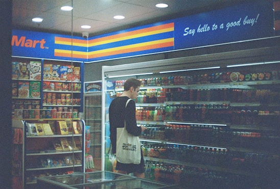 man in black shirt standing near the counter