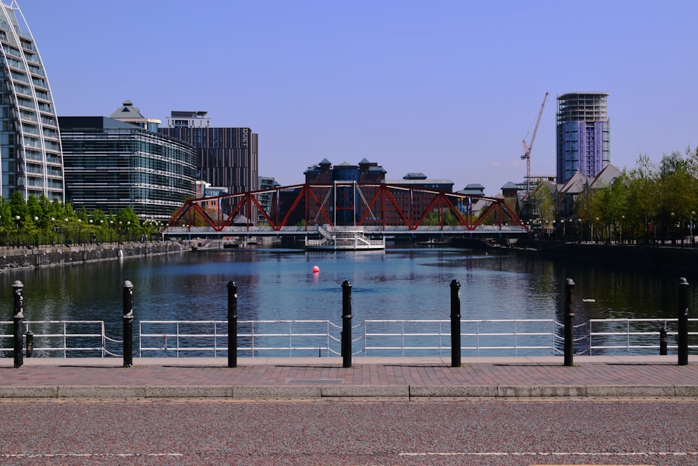 body of water near city buildings during daytime